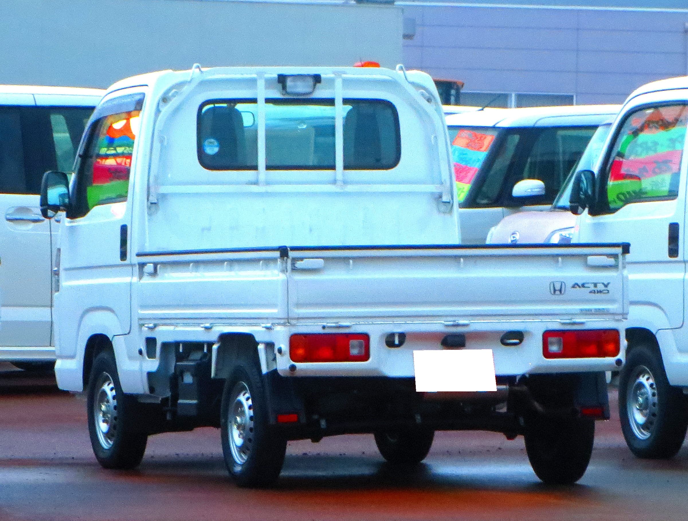 White Honda Acty Truck HA9 SDX 4WD kei truck front three-quarter view